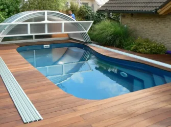 Full swimming pool enclosure retracted - Arcus Products